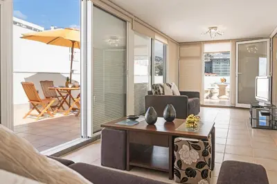a living room with a couch and a table at Jasmineiro III by An Island Apart in Funchal