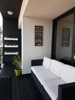 a living room with a white couch in a room at Green Apartment in Funchal