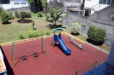 a playground with a slide at Green Apartment in Funchal