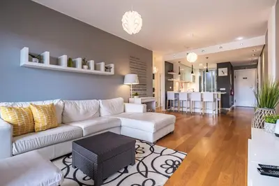 a living room with a white couch and a table at Green Apartment in Funchal