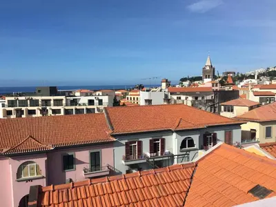 a view of roofs of buildings in a city at Five Design Rooftop by Storytellers in Funchal