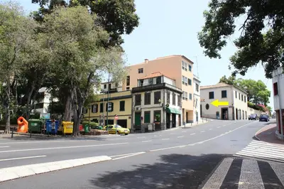 an empty street with buildings on the side of the road at Apartments Madeira City Center in Funchal