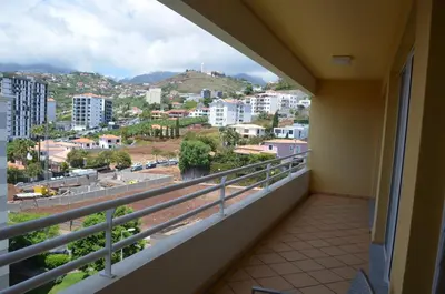 a balcony with a view of a city at Enzo Apartament in Funchal