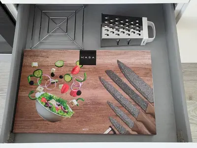 a cutting board with a bunch of vegetables and knives at Madeira Blue House in Calheta