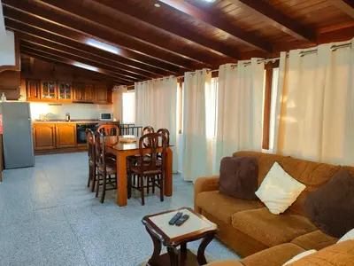 a living room with a couch and a table at Rochinha House in Funchal