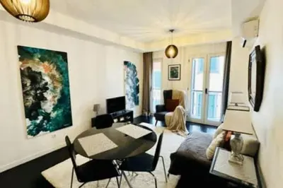 a bedroom with a bed with a mirror on the wall at Artist Loft - Modern Stay in Historic Old Town in Funchal