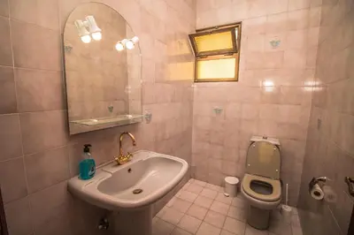 a bathroom with a sink and a toilet at Monte Vista Hermosa in Funchal