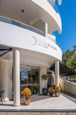 a building with a sign that reads vila balanca healing at Vila Baleira Residence in Funchal