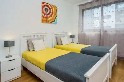 two beds sitting next to each other in a bedroom at The Bay View - by LovelyStay in Funchal