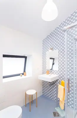 a bathroom with a sink and a mirror at Endless Blue House in Arco da Calheta