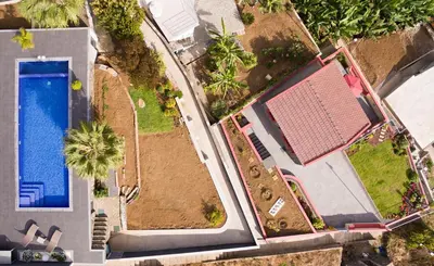 an overhead view of a house with a swimming pool at Endless Blue House in Arco da Calheta