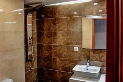 a bathroom with a sink and a shower at Horizon View Madeira in Caniço