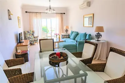a living room with a glass table and chairs at Boavista Fairviews Village in Lagos