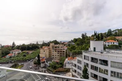 an aerial view of a city with a building at Magnolia Apartment Luxury Apt Great views in Funchal