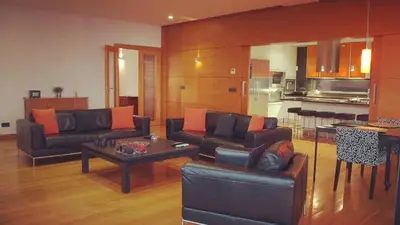 a living room with two couches and a table at Villa Cary in Funchal