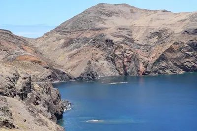 a mountain with a lake in the middle of it at Estacada Apartment in Machico