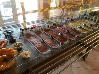 a buffet line with many different types of food at Club House CVL in Luz