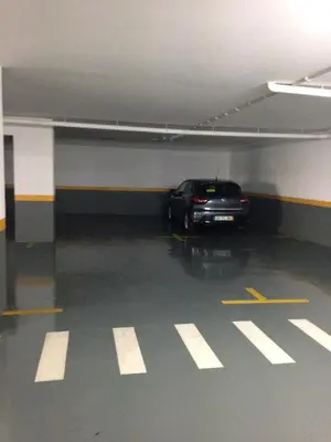 a car is parked in a parking garage at Costa Sol IX by Madeira Holiday Rentals in Funchal