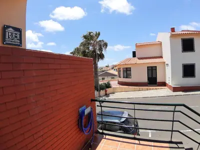 a car parked on a balcony of a building at Refugio das Matas in Porto Santo