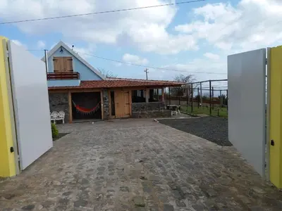 a house with a large driveway in front of it at Vila Vinha in Arco da Calheta