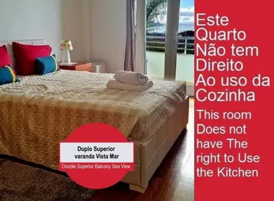 a poster of a bedroom with a bed with a sign at Colinas do Sol in Funchal