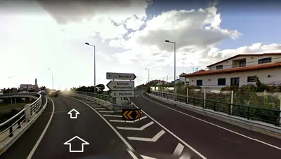 an empty highway with street signs on it at Colinas do Sol in Funchal