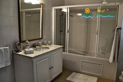 a bathroom with a sink and a shower at OurMadeira - Villa Luzia in Funchal