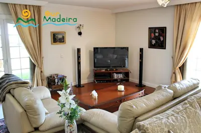 a living room with two couches and a tv at OurMadeira - Villa Luzia in Funchal
