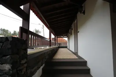 a hallway of a building with stairs and a wall at Casa D'Avo Beatriz in Gaula