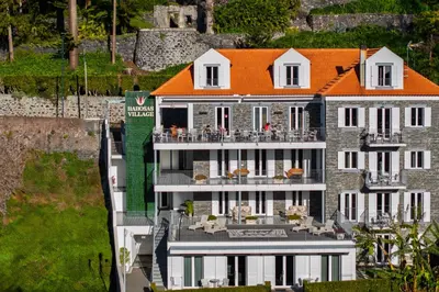 an aerial view of a building with an orange roof at OurMadeira - Babosas Village in Funchal