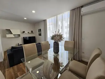 a living room with a glass table and chairs at Mary Jane Apartment Funchal by Rentallido in Funchal