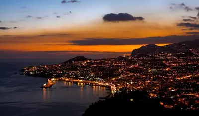 a view of a city at night with the water at Mary Jane Apartment Funchal by Rentallido in Funchal
