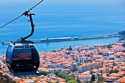 a gondola flying over a city with a pier at Mary Jane Apartment Funchal by Rentallido in Funchal