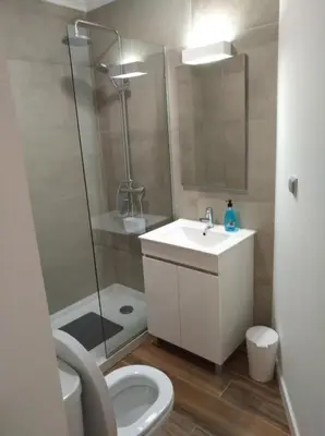 a bathroom with a toilet and a sink and a shower at Mary Jane Apartment Funchal by Rentallido in Funchal