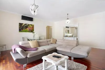 a living room with a couch and a table at Dorisol I Casa Branca Apartment by Rentallido in Funchal