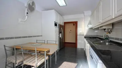 a kitchen with a table and chairs and a sink at Dorisol I Casa Branca Apartment by Rentallido in Funchal