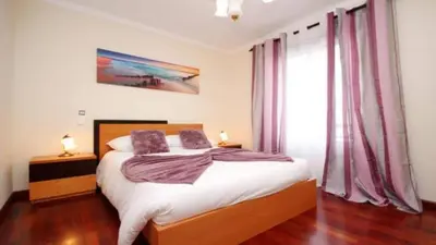 a bedroom with a bed with two pillows on it at Dorisol I Casa Branca Apartment by Rentallido in Funchal