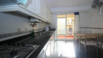 a kitchen with a stove and a counter top at Dorisol I Casa Branca Apartment by Rentallido in Funchal