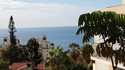 a view of the ocean from a building at Dorisol I Casa Branca Apartment by Rentallido in Funchal
