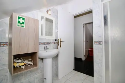 a bathroom with a sink and a mirror at Casa Maria in Funchal