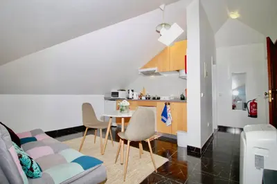 a living room with a couch and a table at Casa Maria in Funchal