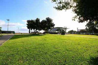 a large grassy field with trees in a park at Casa Maria in Funchal