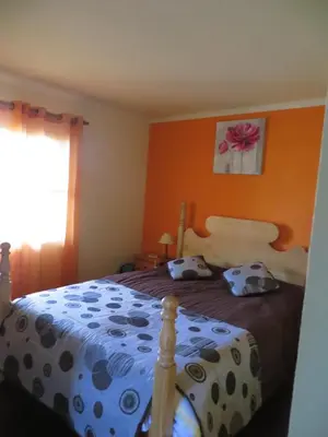a bedroom with a bed with two pillows on it at Quinta da quebrada in Santana