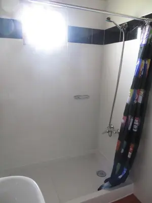 a bathroom with a shower with a shower curtain at Quinta da quebrada in Santana