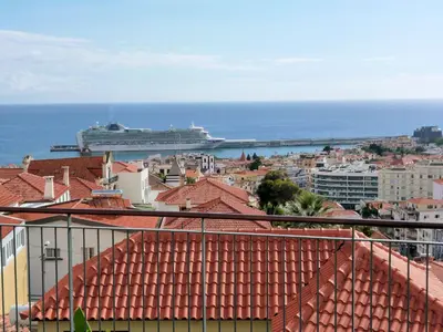 a city with a cruise ship in the water at Luxury Apartment Living Funchal in Funchal