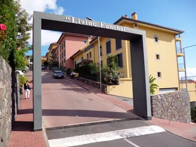 a sign for a living entrance on a street at Luxury Apartment Living Funchal in Funchal