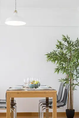 a dining room table with glasses on top of it at Barreiros I by An Island Apart in Funchal