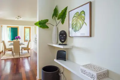 a living room and dining room with a dining table at The Cliff Side Apartment in Funchal
