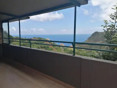 a balcony with a view of the ocean at Vista Boa in Porto da Cruz