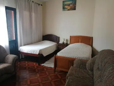 a living room with two beds and a couch at Vista Boa in Porto da Cruz